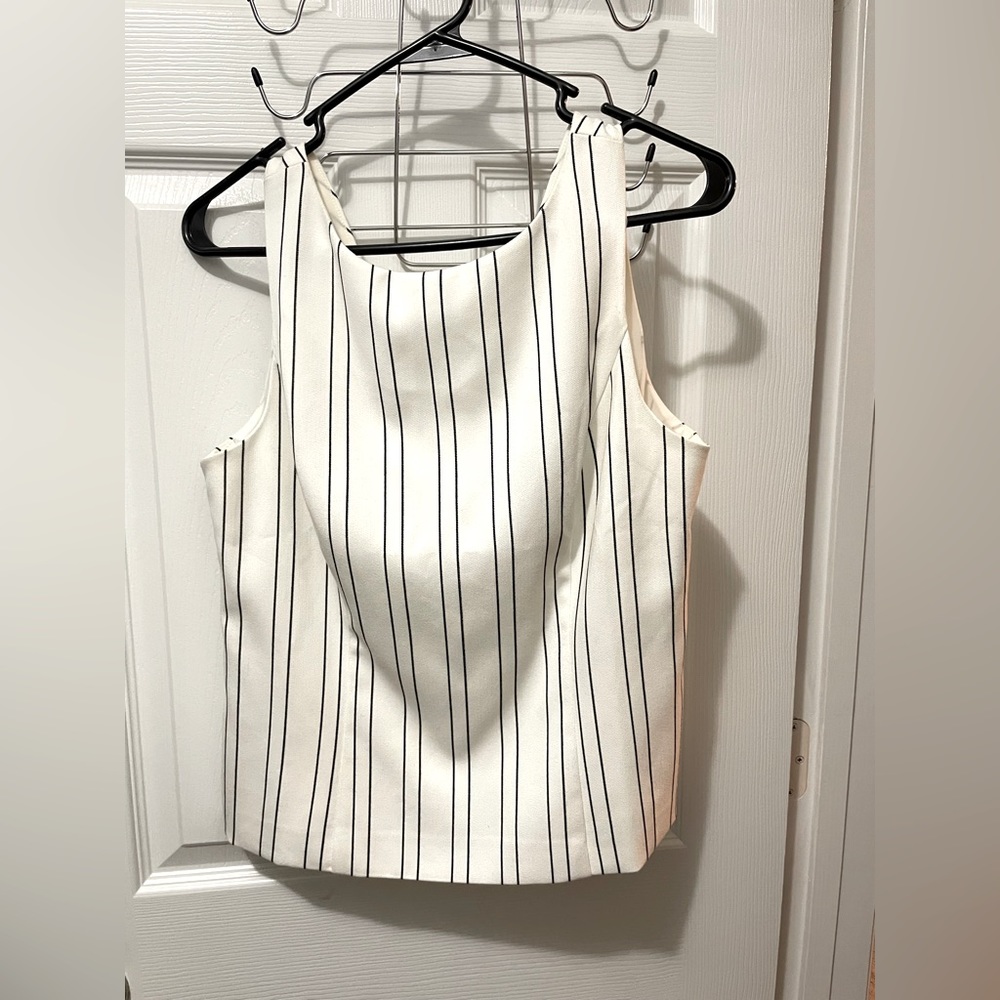 Work top, high neck, V back with zipper.